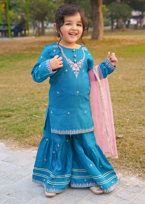 fashion dress images Teal Blue Layered Party Gown for Girls with Smocked Bodice & One-Shoulder  Pleated Flower Design Gown